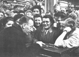 Wilfred Pickles pictured with a group of factory workers for a 1947 edition of Have a Go.