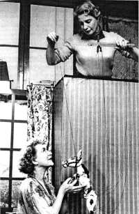 Annette Mills at the piano with Muffin the Mule, whilst up above Ann Hogarth pulls the strings