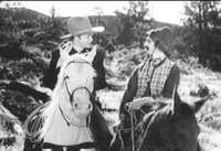 Ritter and his horse 'White Flash' with sidekick Arkansas Slim Andrews